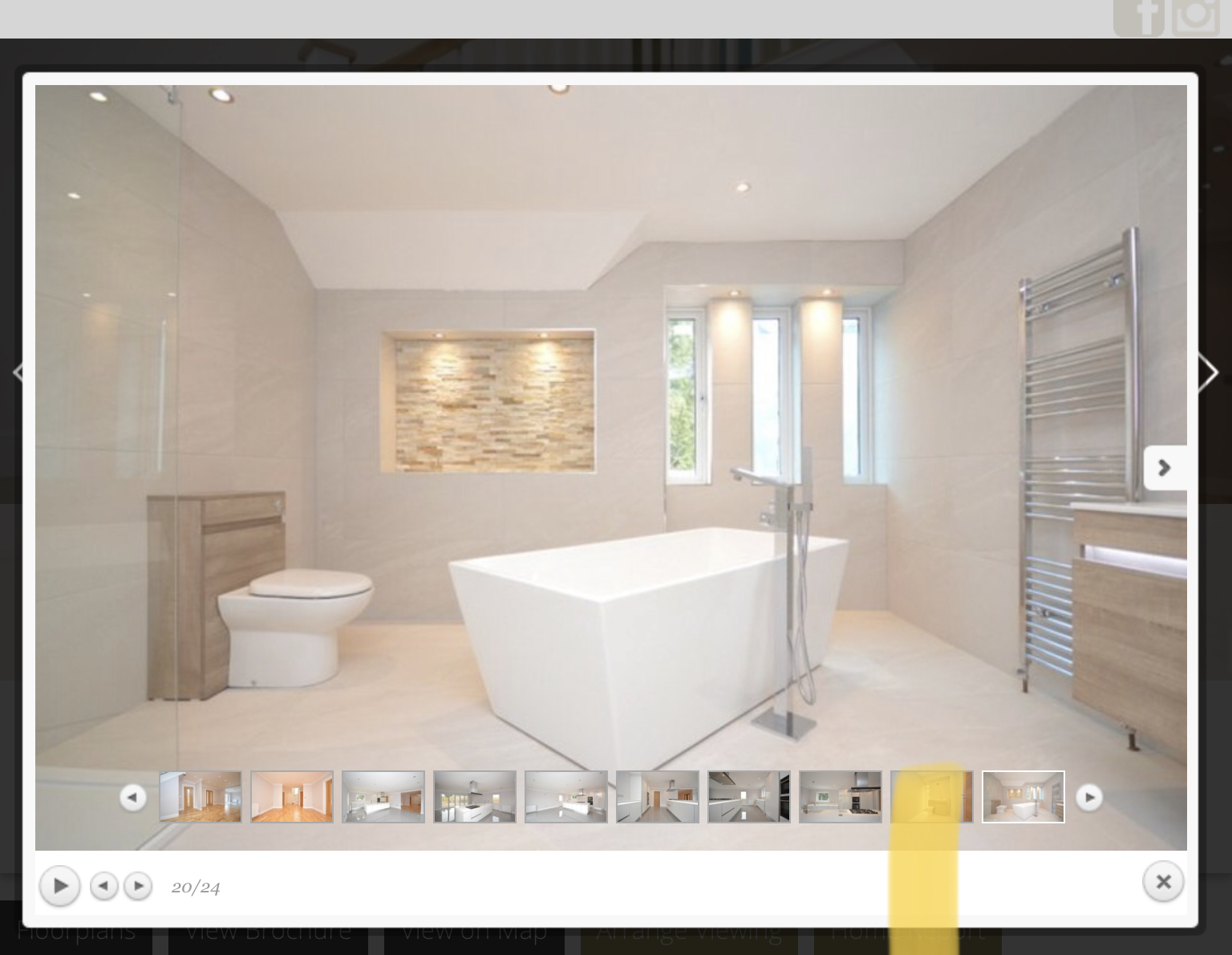 Fully tiled family bathroom with freestanding bath