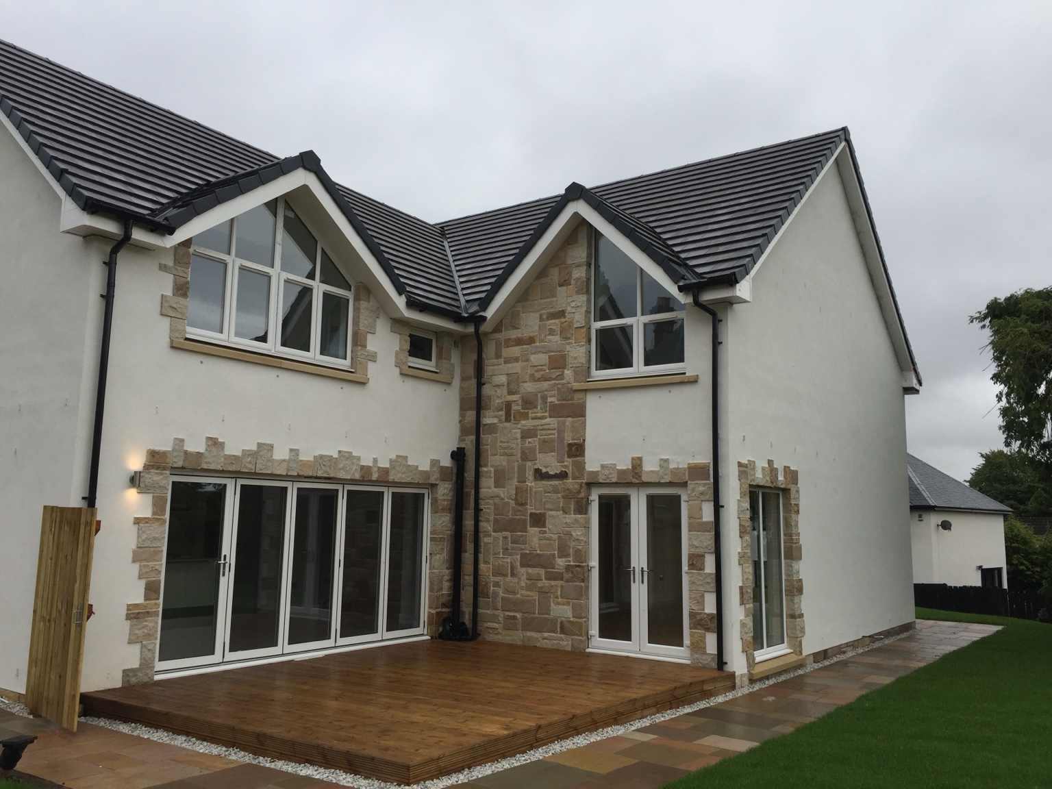 Rear courtyard, stone detailing and bi-folding doors