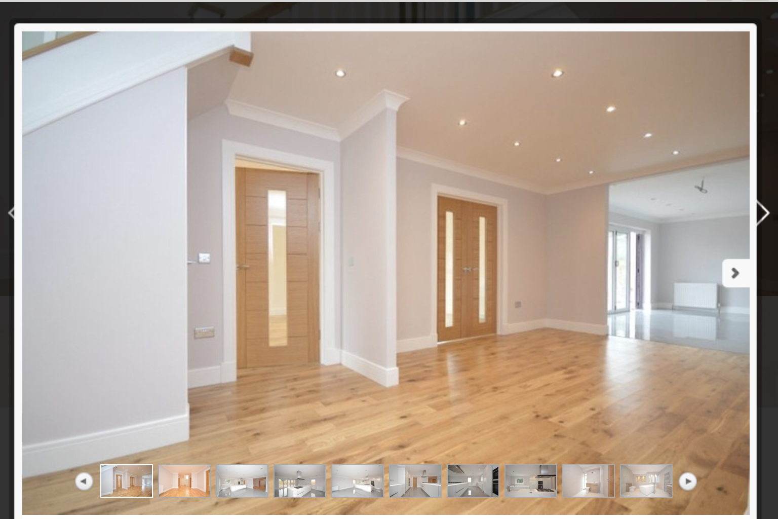 Open-plan living area with oak flooring and contemporary internal doors